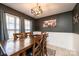 Dining room features a wood table and chairs, and a large Gathering portrait at 5241 Whitewater Dr, Hickory, NC 28601