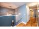 Upstairs hallway with stairs and light fixture at 5241 Whitewater Dr, Hickory, NC 28601