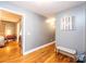 Hallway with hardwood floors, leading to bedroom and other areas of home at 5241 Whitewater Dr, Hickory, NC 28601