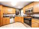 Kitchen with oak cabinets and stainless steel appliances at 5241 Whitewater Dr, Hickory, NC 28601