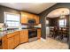 Spacious kitchen with oak cabinets, stainless steel appliances, and an adjacent dining area at 5241 Whitewater Dr, Hickory, NC 28601