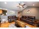 Living room with hardwood floors, vaulted ceiling, and leather furniture at 5241 Whitewater Dr, Hickory, NC 28601