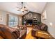 Spacious living room with vaulted ceilings, hardwood floors, and leather furniture at 5241 Whitewater Dr, Hickory, NC 28601