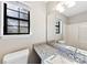 Bathroom with granite countertop and window at 5811 Rocky Mount Ct, Charlotte, NC 28214