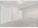 Bedroom with carpet and built in closet at 5811 Rocky Mount Ct, Charlotte, NC 28214