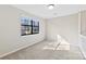 Well-lit bedroom with carpeted floor and window at 5811 Rocky Mount Ct, Charlotte, NC 28214