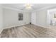 Bright bedroom with hardwood floors and double doors at 5811 Rocky Mount Ct, Charlotte, NC 28214