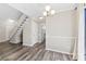 Bright dining room with hardwood floors and staircase at 5811 Rocky Mount Ct, Charlotte, NC 28214