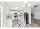 Modern kitchen with white cabinets and granite counters at 5811 Rocky Mount Ct, Charlotte, NC 28214