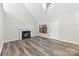 Living room with fireplace and lots of natural light at 5811 Rocky Mount Ct, Charlotte, NC 28214