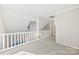 Upstairs hallway with white railing and carpet at 5811 Rocky Mount Ct, Charlotte, NC 28214