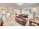 Relaxing bonus room with leather recliner and wooden side table at 6141 Russo Ct, Lancaster, SC 29720