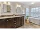 Elegant bathroom with double vanity, soaking tub, and walk-in shower at 616 N Oak Dr, Huntersville, NC 28078