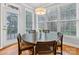 Bright breakfast nook with round table and chairs near sliding door at 616 N Oak Dr, Huntersville, NC 28078