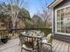 Deck with a glass-top table and four chairs, overlooking backyard at 616 N Oak Dr, Huntersville, NC 28078