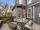 Deck with a glass-top table and four chairs, overlooking backyard at 616 N Oak Dr, Huntersville, NC 28078