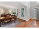 Bright dining room with hardwood floors and large windows at 616 N Oak Dr, Huntersville, NC 28078