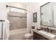 Full bathroom featuring modern fixtures, tile surround, and a framed mirror above the sink at 6248 Raven Rock Dr, Denver, NC 28037