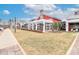 Exterior of the clubhouse with a covered patio, landscaped grounds, and ample parking at 6248 Raven Rock Dr, Denver, NC 28037