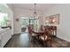 Dining area with a large table and chairs, elegant lighting, and sliding doors at 6248 Raven Rock Dr, Denver, NC 28037