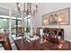 Elegant dining room features a large table set for a formal meal with sliding glass door access at 6248 Raven Rock Dr, Denver, NC 28037