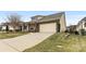 House exterior featuring a two-car garage and landscaping at 6248 Raven Rock Dr, Denver, NC 28037