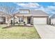 Inviting single-Gathering home with a brick and tan facade, covered front porch with seating, and an attached two-car garage at 6248 Raven Rock Dr, Denver, NC 28037