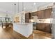 Modern kitchen with dark brown cabinets and a large island at 6248 Raven Rock Dr, Denver, NC 28037