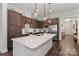 Stylish kitchen showcasing a center island with quartz countertop, stainless steel appliances, and elegant cabinetry at 6248 Raven Rock Dr, Denver, NC 28037