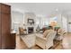 Bright living room with hardwood floors, fireplace, and comfortable seating area at 6248 Raven Rock Dr, Denver, NC 28037