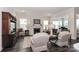 Elegant living room featuring a fireplace, natural light, and comfortable furnishings at 6248 Raven Rock Dr, Denver, NC 28037