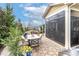 Inviting stone patio with outdoor seating and views of the landscaped backyard at 6248 Raven Rock Dr, Denver, NC 28037