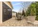 Stone patio with seating area and screened porch at 6248 Raven Rock Dr, Denver, NC 28037