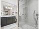 Modern bathroom with dark vanity and walk-in shower at 6328 County Donegal Ct, Charlotte, NC 28277