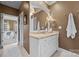 Bathroom with a single vanity and built-in mirror at 6328 County Donegal Ct, Charlotte, NC 28277