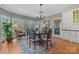 Bright breakfast nook with charming table and chairs, offering garden views at 6328 County Donegal Ct, Charlotte, NC 28277