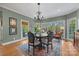 Bright breakfast nook with a round table, chairs, and access to the backyard at 6328 County Donegal Ct, Charlotte, NC 28277