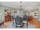 Elegant dining area with round table and four chairs, featuring a floral rug at 6328 County Donegal Ct, Charlotte, NC 28277