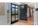 Open black front door with glass panels, offering a view of the yard at 6328 County Donegal Ct, Charlotte, NC 28277