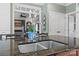 Kitchen island with double sink, granite countertop, and modern faucet at 6328 County Donegal Ct, Charlotte, NC 28277