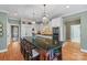 Large kitchen with island, stainless steel appliances, and white cabinets at 6328 County Donegal Ct, Charlotte, NC 28277