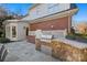 Built-in outdoor kitchen with grill and stone countertops at 6328 County Donegal Ct, Charlotte, NC 28277