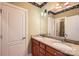 Bathroom with granite countertop, double sinks, and mirror at 6926 Linkside Ct, Charlotte, NC 28277