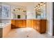 Bathroom with granite countertop, double sinks, and large mirror at 6926 Linkside Ct, Charlotte, NC 28277