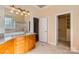 Bathroom with granite countertop, double sinks, and walk-in closet at 6926 Linkside Ct, Charlotte, NC 28277