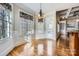 Bright breakfast nook with hardwood floors and built-in window seat at 6926 Linkside Ct, Charlotte, NC 28277