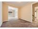 Hallway with carpet and access to other rooms at 6926 Linkside Ct, Charlotte, NC 28277