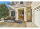 Elegant double front doors with sidelights, and a brick facade at 6926 Linkside Ct, Charlotte, NC 28277