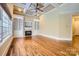 Living room with hardwood floors, fireplace, and built-in shelving at 6926 Linkside Ct, Charlotte, NC 28277