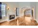 Bright living room with hardwood floors and fireplace at 6926 Linkside Ct, Charlotte, NC 28277